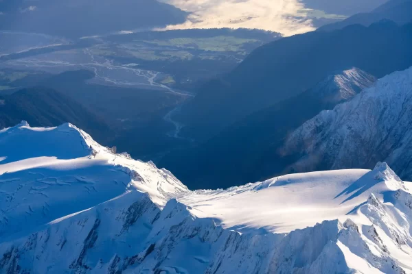 Aerial photo overlooking Franz Josef glacier down to the township below