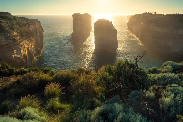 Tom and Eva with the sun going down behind in golden light at Loch Ard Gorge