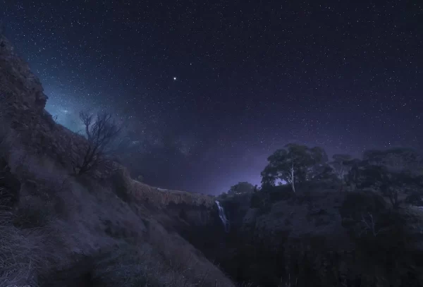 Lal Lal Falls waterfall at night with frost and the Milky Way rising above