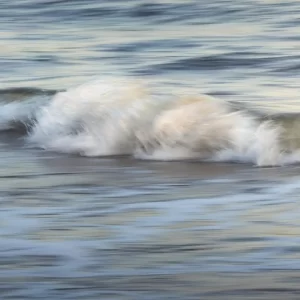 Long exposure photo of waves crashing on the beach