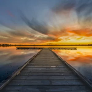 Fly fishing jetty at lake Wendouree with a bright orange and yellow sunset