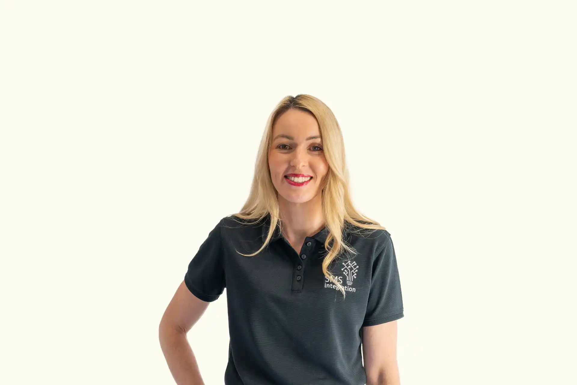 Corporate portrait photograph of a business woman in front of a neutral background