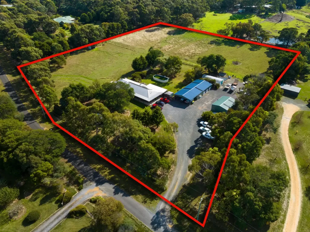 Aerial drone image of a property with an overlay showing the boundary